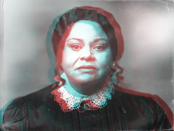 Black and white image with red and blue highlights, showing actor Keala Settle in costume as Mary Todd Lincoln,