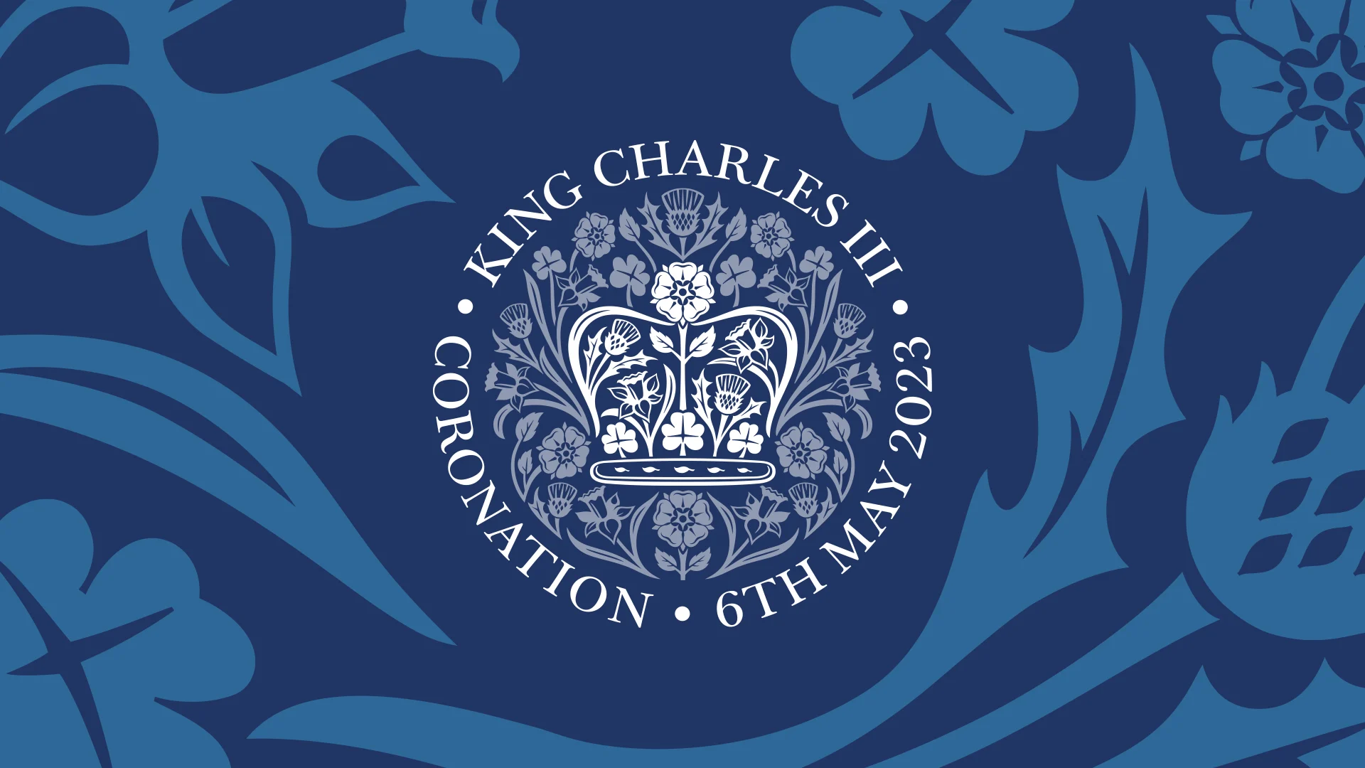 A white crown design on a blue patterned background, for the Coronation of King Charles III, 6th May 2023