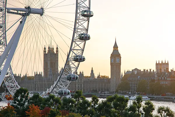 Partial view of the London Eye with the River Thames and Houses of Parliament behind. 