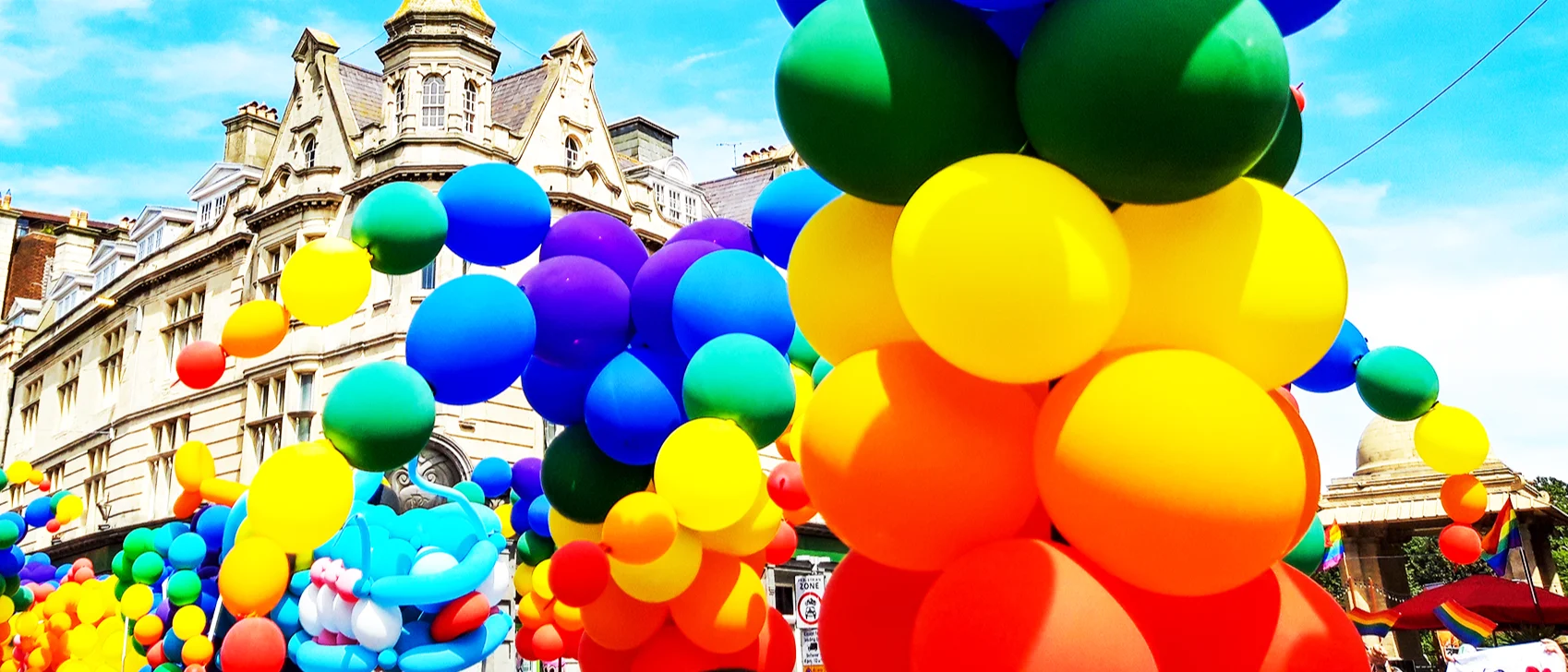 Bunches of rainbow balloons at Brighton's Pride parade