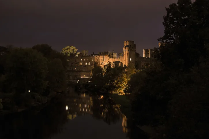 Warwick Castle lit up at night