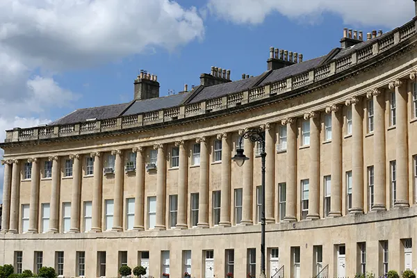 The front of a Georgian crescent of townhouses.