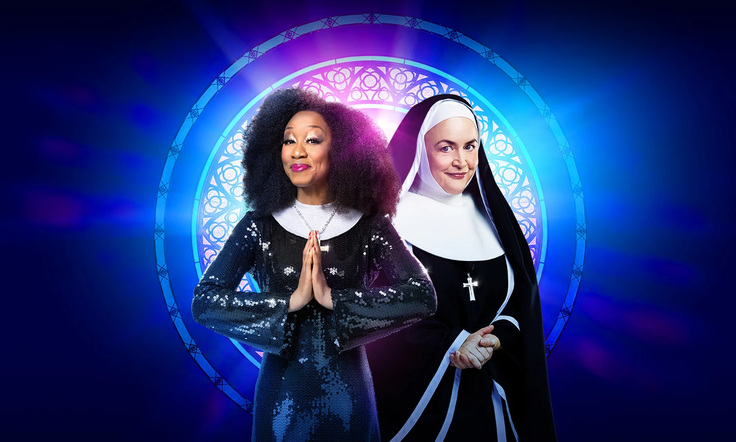 A black woman and a white woman both in nun's habits standing in front of a stained glass window.