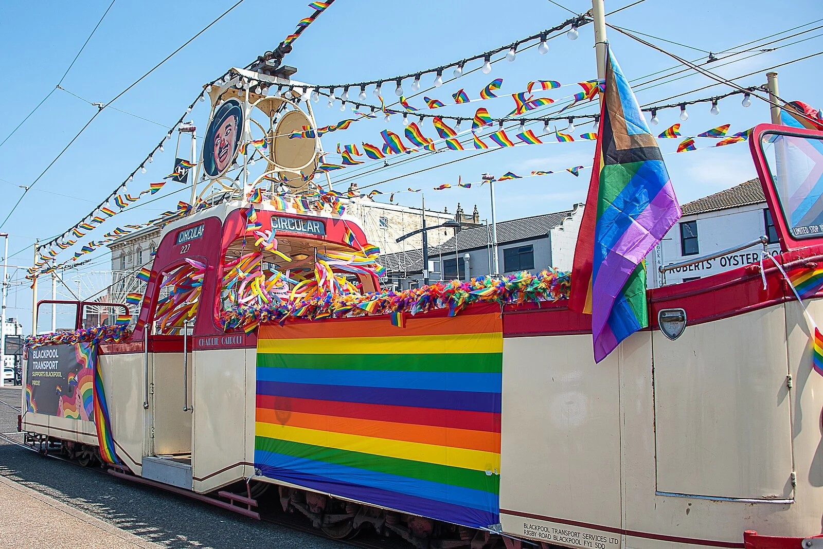 A Blackpool tram covered in rainbow flags and bunting