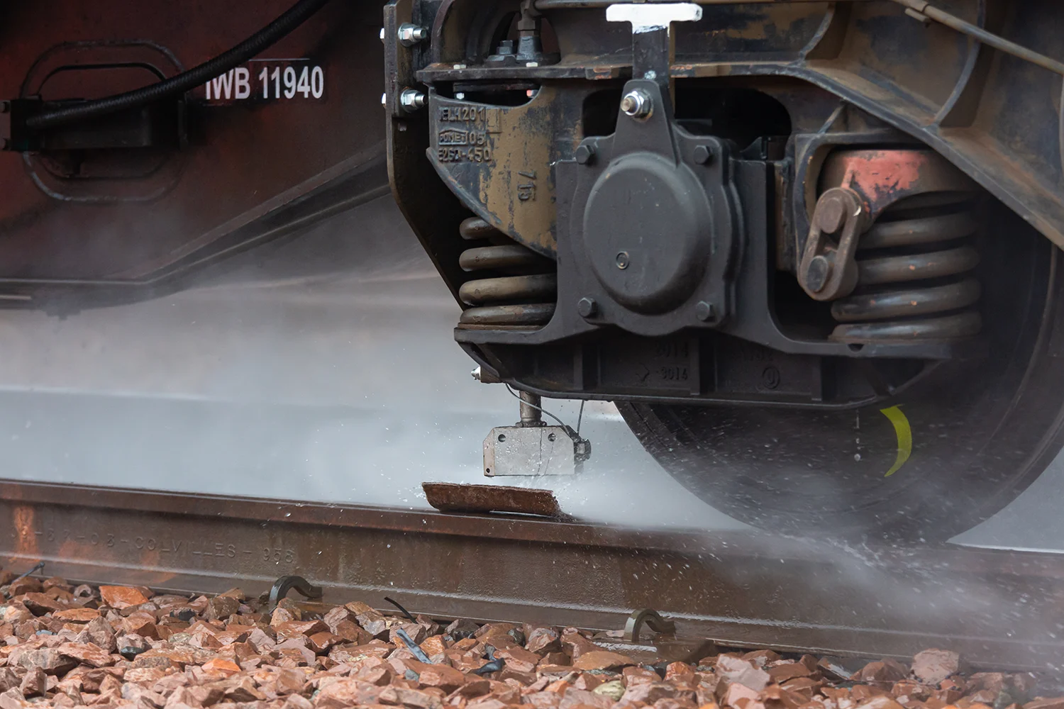 Close up of a water-jetting train cleaning a railway track 